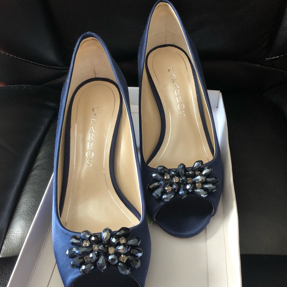 Beautiful blue fancy heels with beaded design on the front.